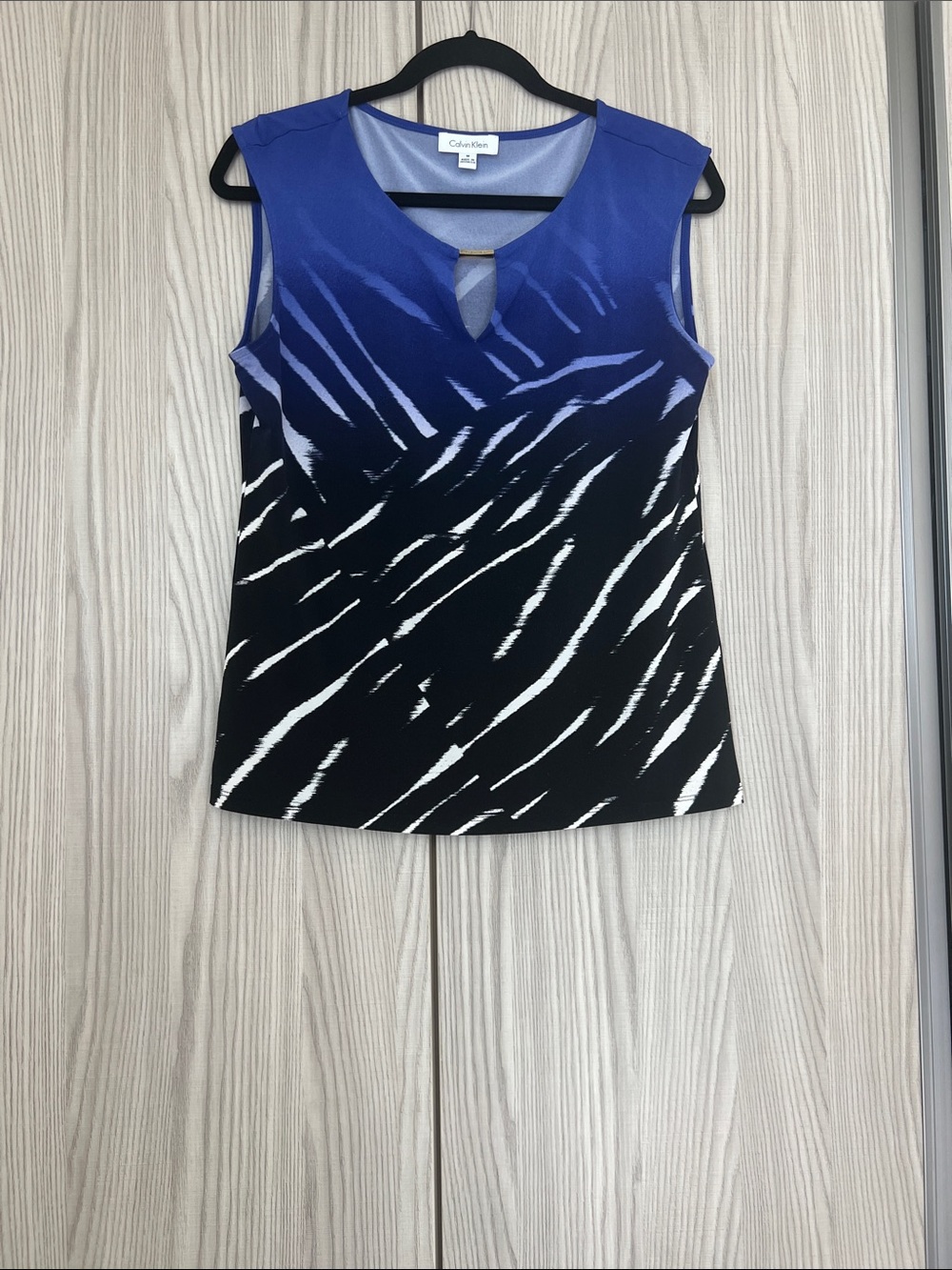 Calvin Klein Blue and Black Zebra-Print V‑Notch top with Gold Accent